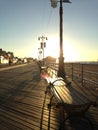 Sunrise on Coney Island Boardwalk. Royalty Free Stock Photo