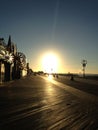 Sunrise on Coney Island Boardwalk. Royalty Free Stock Photo