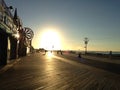 Sunrise on Coney Island Boardwalk. Royalty Free Stock Photo