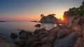 Sunrise on Costa Brava coast. Spanish sea landscape. Morning dawn on sea beach with rocks and cliff