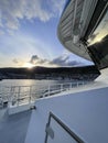 sunrise on the deck of a ferry in a Norwegian fjord