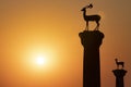 The deer statues at the entrance to Rhodes harbor at sunrise