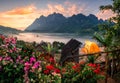 Sunrise on Doi Luang Chiang Dao mountain with foggy, flower blooming and tent camping on balcony in traditional village Royalty Free Stock Photo