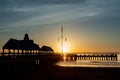 Sunrise in downtown Charleston with buildings silhouettes golden sun background SC, USA