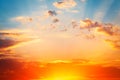 Sunrise dramatic blue sky with orange sun rays breaking through the clouds. Nature background Royalty Free Stock Photo