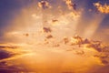 Sunrise dramatic blue sky with orange sun rays breaking through the clouds. Nature background Royalty Free Stock Photo