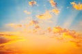 Sunrise dramatic blue sky with orange sun rays breaking through the clouds. Nature background Royalty Free Stock Photo