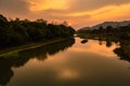 Sunrise dramatic sky at dawn with leading river water flow and forest trails Royalty Free Stock Photo