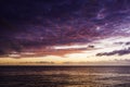 Sunrise with dramatic sky over sea