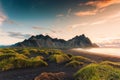 Sunrise dramatic sky over Vestrahorn mountain on black sand beach in Stokksnes peninsula at Iceland Royalty Free Stock Photo