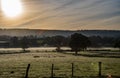 Sunrise and early morning mist over fields Beautiful countryside view Royalty Free Stock Photo