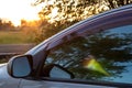 Sunrise in the early morning, reflecting the mirror outside the car