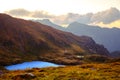 Sunrise on Fagaras mountain ridges over the Capra glacier lake Royalty Free Stock Photo