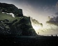 Sunrise at famous Black Sand Beach Reynisfjara in Iceland. Windy Morning. Ocean Waves. Colorful Sky. Morning Sunset.