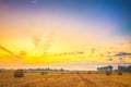 Sunrise field, hay bale in Belarus. Royalty Free Stock Photo