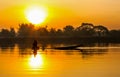 Sunrise fisherman and dinghy