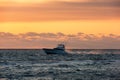 Sunrise and fishing vessel over the Atlantic Ocean Royalty Free Stock Photo