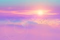 sunrise and flare back horizon sky with pastel pink tone cloud and fog over on top mountain with birds flying Royalty Free Stock Photo