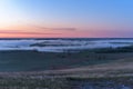 Sunrise, fog over the river panorama of the landscape in the early morning. pink sky before sunrise . background image Royalty Free Stock Photo