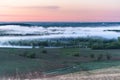 Sunrise, fog over the river panorama of the landscape in the early morning. pink sky before sunrise . background image Royalty Free Stock Photo