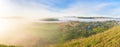 Sunrise, fog over the river panorama of the landscape in the early morning. thick fog is illuminated by the sun`s rays in summer Royalty Free Stock Photo