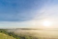 Sunrise, fog over the river panorama of the landscape in the early morning. thick fog is illuminated by the sun`s rays in summer Royalty Free Stock Photo