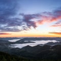 Sunrise. Foggy morning. Scenery with high mountains. Orange sky. Forest. Wild Carpatian touristic place. Natural landscape Royalty Free Stock Photo