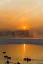 sunrise on a frosty foggy morning over the Yenisei River Royalty Free Stock Photo