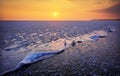 Sunrise and frozen sea. Beautiful winter landscape with lake in morning time. Daybreak Royalty Free Stock Photo