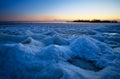 Sunrise and frozen sea. Beautiful winter landscape with lake in morning time. Daybreak Royalty Free Stock Photo