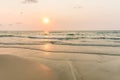 Sunrise and gentle wave at the tropical beach Royalty Free Stock Photo