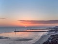 Sunrise Globe at low tide. Royalty Free Stock Photo