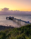 Sunrise golden light over Llandudno Pier in the Victorian seaside resort in North Wales Royalty Free Stock Photo