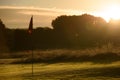 Sunrise Golf Course Putting Green, Autumn Dew on flag Royalty Free Stock Photo
