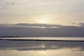 Sunrise halo above mountains and Dead Sea