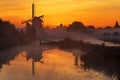 Sunrise heats up the canal water into the mist Royalty Free Stock Photo