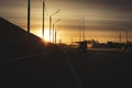 Sunrise on highway road in left side view mirror driver. Focus on reflection in smaller mirror. Royalty Free Stock Photo