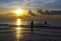 Sunrise idyllic and fisherman at the beach Royalty Free Stock Photo