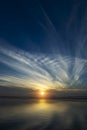 Sunrise at the lake with cloud and small sun Royalty Free Stock Photo