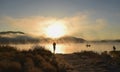 Sunrise at the lake Kawaguchiko,People fishing on a boat,silhoue Royalty Free Stock Photo