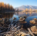 Sunrise at lake in mountain range. Beautiful reflection in water