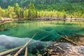 Sunrise at lake in mountain range. Beautiful reflection in water