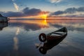 Sunrise on Lake Seliger with an old boat in the foreground. Royalty Free Stock Photo