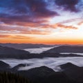 Sunrise. Landscape with high mountains. Orange sky. Foggy morning. Forest. Wild Carpatian touristic place. Natural landscape