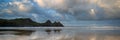 Sunrise landscape panorama Three Cliffs Bay in Wales with dramatic sky Royalty Free Stock Photo