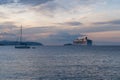 Sunrise landscapes at Dubrovnik seaside, with a huge cruise ship and small fishing boats on the Adriatic Sea Royalty Free Stock Photo