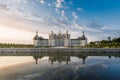 Sunrise landscapes with river reflection at Chambord castle