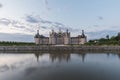 Sunrise landscapes with river reflection at Chambord castle