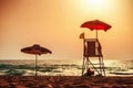 Sunrise with life guard station silhouette Royalty Free Stock Photo