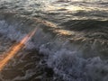 Sunrise Light on Pacific Ocean Waves on Beach in Kapaa on Kauai Island in Hawaii. Royalty Free Stock Photo